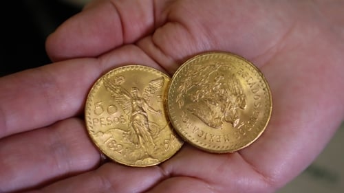 Two gold coins from Mexico were hidden in the spine of a prayer book