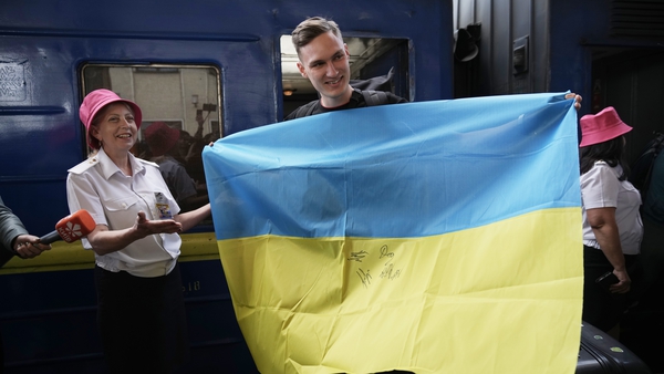 Ihor Didenchuk of the Kalush Orchestra is welcomed home as he arrives at Kyiv railway station on Tuesday Photos: Getty Images
