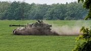 A Ukrainian self-propelled Howitzer moves on a field near Sydorove, eastern Ukraine