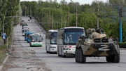 Buses left the steelworks late on Monday in a convoy escorted by Russian armoured vehicles
