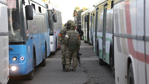 Surrendered servicemen of Ukraine's national battalion 'Azov' pictured yesterday being transferred in Mariupol