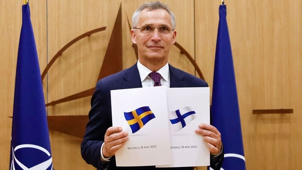 NATO Secretary-General Jens Stoltenberg pictured with Sweden's and Finland's application letters