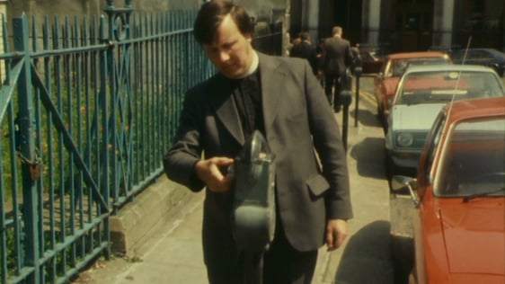 Using a parking meter in Dublin city, 1977.