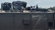 A Russian soldier seen in an armoured vehicle on a roadside in the Kherson region