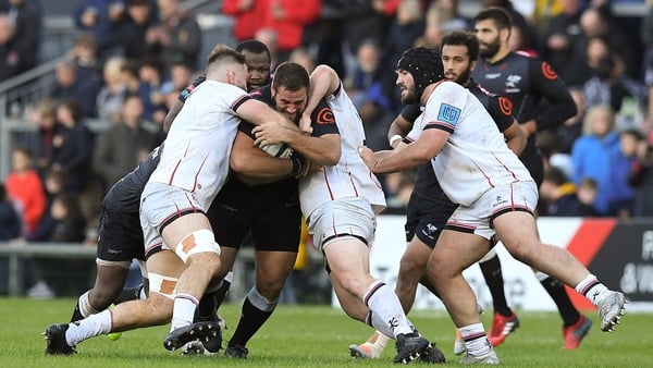 Ulster pair Andrew Warwick and Alan O'Connor put in a big tackle on Sharks prop Thomas du Toit