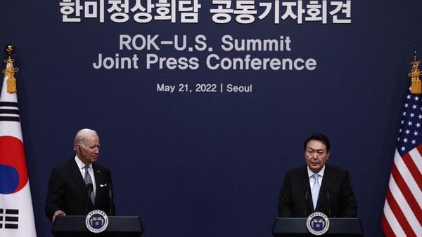 US President Joe Biden, left speaks with South Korean President Yoon Suk-yeol during a joint press conference at the presidential office in Seoul