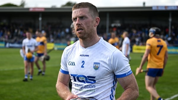 Waterford's Ian Kenny leaves the pitch dejected after his team's heavy loss to Clare in Cusack Park