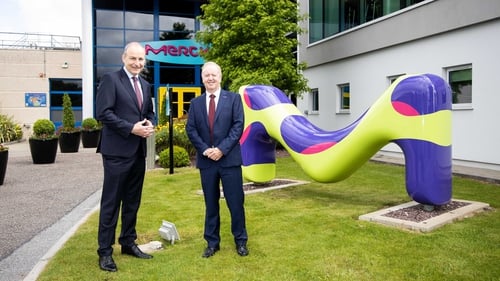 Taoiseach Micheál Martin and Martin McAuliffe, Managing Director and Head of Cork Operations at Merck, at today's jobs announcement