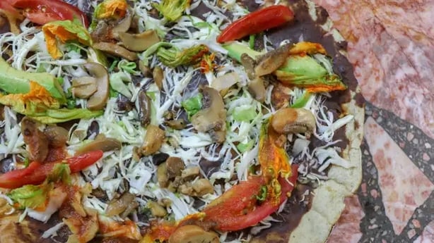 Tlayuda is a traditional Oaxacan dish cooked over a grill (Alamy/PA)