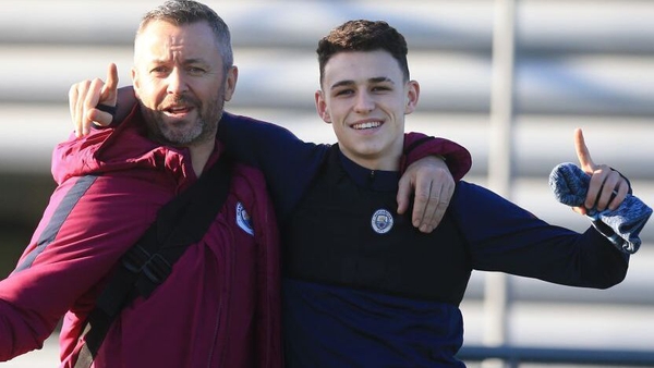 Donough Holohan (L) pictured with Manchester City's Phil Foden at training in 2018