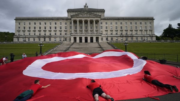 A giant campaign flag was unfurled at the front of Parliament Building at Stormont this morning