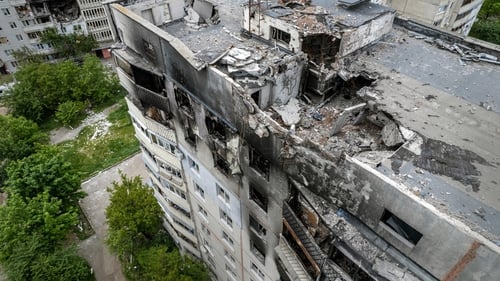A large apartment building stands in ruins today in Kharkiv, Ukraine