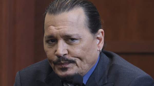 Johnny Depp reacts as he testifies in the courtroom during his defamation trial against his ex-wife Amber Heardon Wednesday (Photo by EVELYN HO CKSTEIN / POOL / AFP) (Photo by EVELYN HOCKSTEINPOOL/AFP via Getty Images)