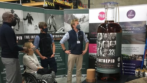 Explorers Dwayne Fields, Karen Darke, Will Copestake and Olly Hicks watch The Intrepid being filled with the whisky