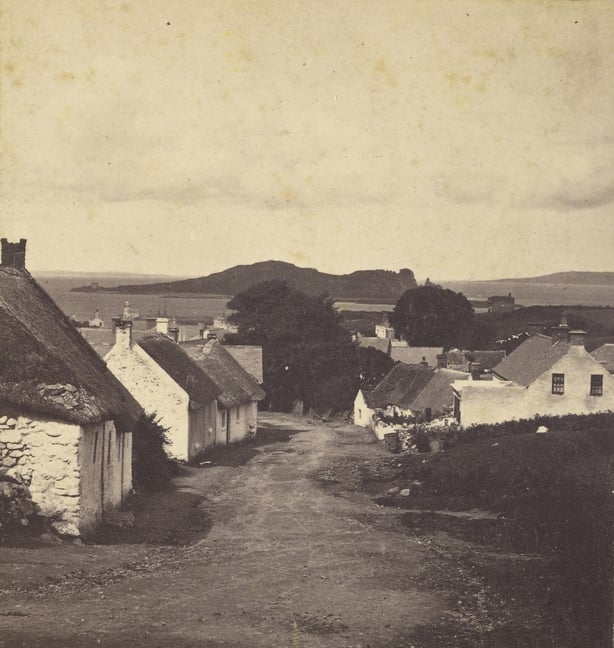 Howth in 1865, small cottages on a road going down to the sea