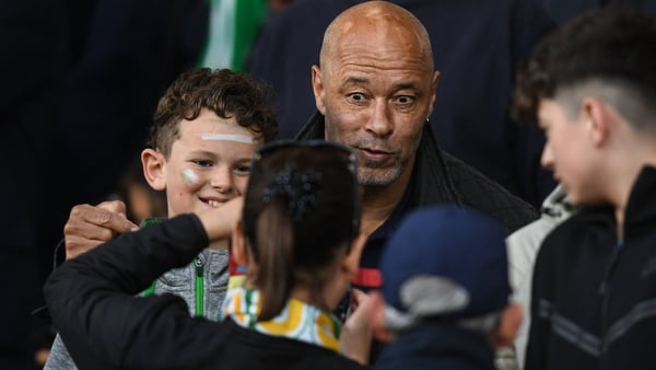 Paul McGrath poses with fans at Tallaght Stadium