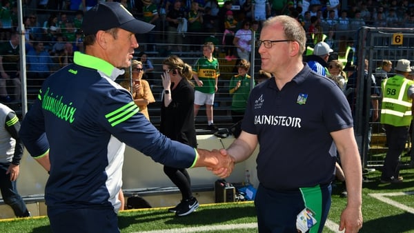 Kerry manager Jack O'Connor (L) and Limerick manager Billy Lee shake hands after the Munster final