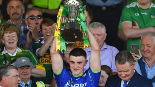 Sean O'Shea lifts the cup after the 23-point victory