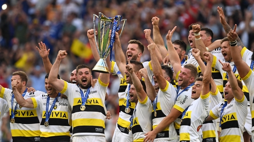 La Rochelle players celebrate with the Champions Cup trophy