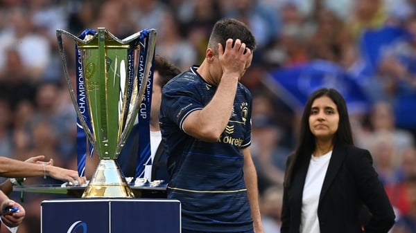 A dejected Johnny Sexton walks past the Champions Cup trophy after Leinster's defeat to La Rochelle.