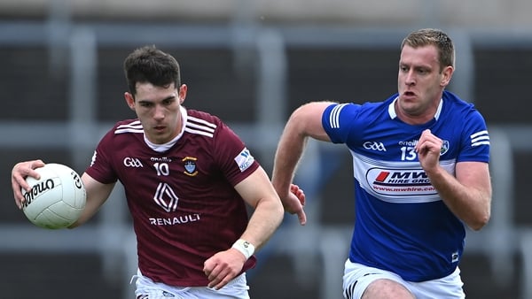 Sam McCartan of Westmeath in action against Donal Kingston of Laois