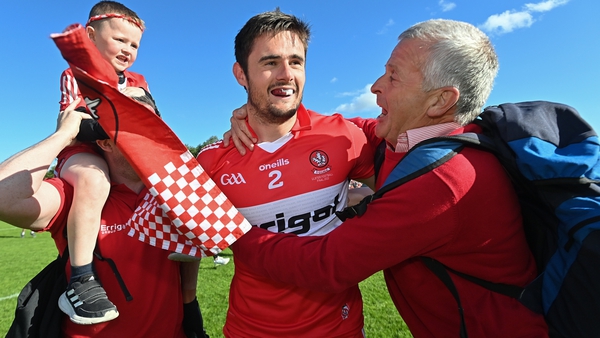 Chrissy McKaigue (centre) is mobbed after Derry's Ulster SFC win