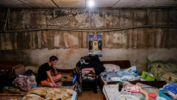 A man plays on his laptop in a bunker in the town of Soledar in the Donetsk region, about 5km from the eastern frontline