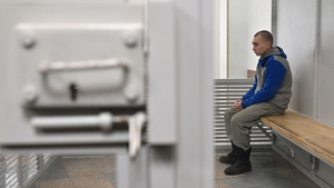 Russian sergeant Vadim Shishimarin sits in the defendant's box on 23 May, the last day of his trial, after which he was found guilty of war crimes for having killed a civilian on 28 February