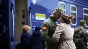A Ukrainian serviceman says goodbye to his girlfriend before departing for Kyiv on 9 March