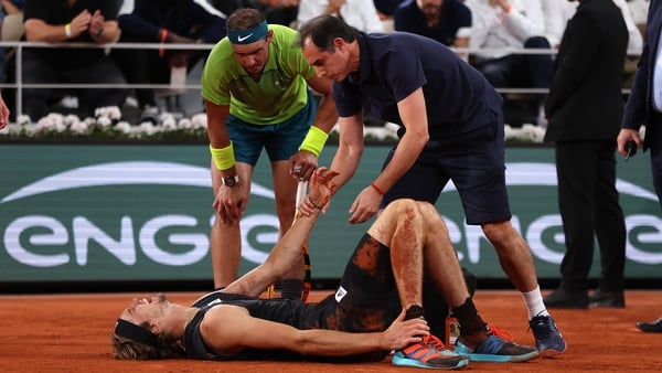 Alexander Zverev receives medical attention after suffering a bad injury