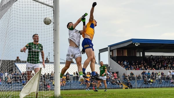 Clare's Pearse Lillis fists the ball into the Meath net