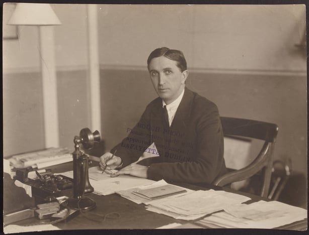 JJ Walsh sitting at his desk