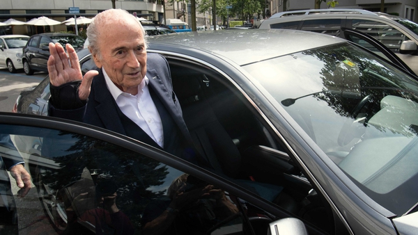Sepp Blatter, waves as he leaves the building of the Office of the Attorney General of Switzerland