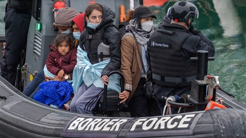 Asylum seekers arriving into Dover docks on a Border Force RIB after being rescued in the English Channel in May