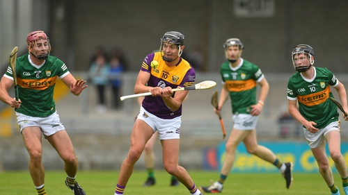Wexford's Jack O'Connor in action against Kerry's Fionán Hennessy and Colin Walsh