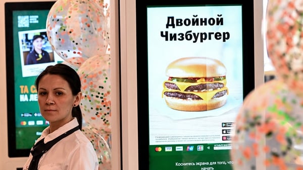 An employee at Vkusno & Tochka, the new chain which has taken over McDonald's restaurants in Russia after the fast food giant left the country. Photo: Kirill Kudryavtsev/AFP via Getty Images