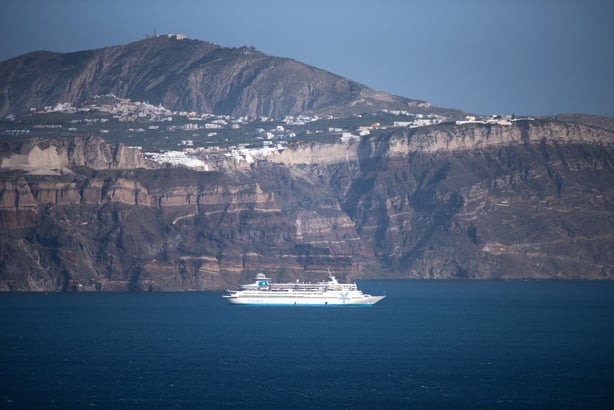 Whitewashed houses on approach to Santorini gave the impression of snow-capped cliffs (Celestyal/PA)