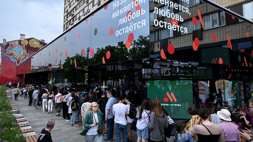 Customers stand in line to eat at the Russian version of a former McDonald's restaurant in Moscow