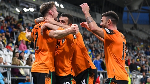 Nathan Collins celebrates his superb goal with his Ireland team-mates