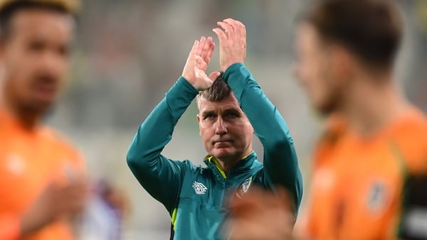 Stephen Kenny applauds the travelling Irish support following the game in Lodz