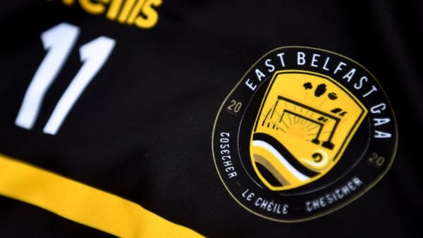 East Belfast's club crest features the iconic Harland & Wolff cranes, a sunrise, the Red Hand of Ulster, a shamrock and a thistle and the word 'Together' written in English, Irish and Ulster-Scots.