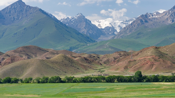 Farmland near Lake Issyk Kul in the foothills of the Tian Shan mountains (File photo)