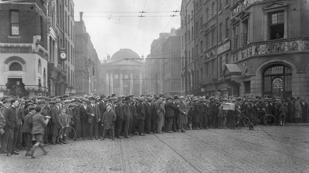 A crowd watches the burning Four Courts