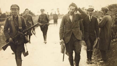 Anti-Treaty IRA Prisoner being escorted by National Army patrol in Kerry/West Limerick, 1922. Reproduced courtesy of the National Library of Ireland.