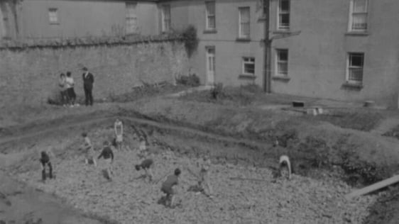 Children digging foundations for swimming pool, Limerick (1967)