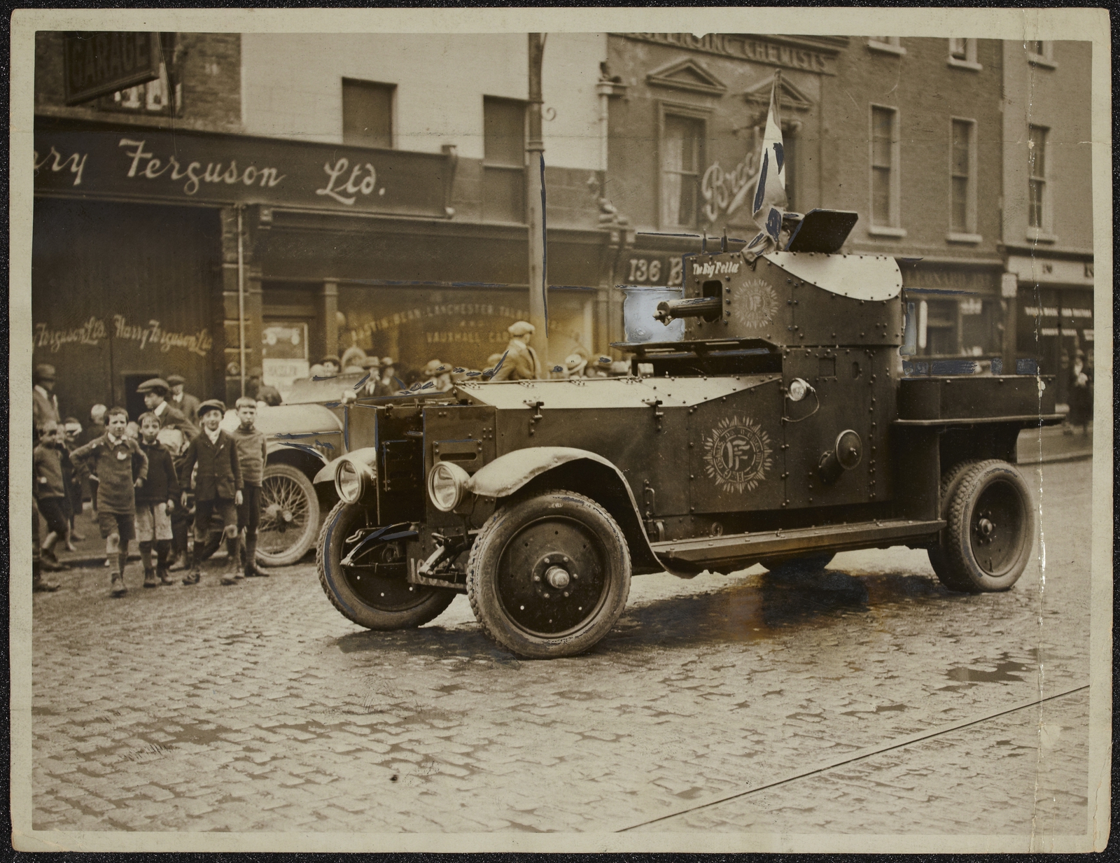 Image - Free State Armoured Car 'The Big Fellow' outside Ferguson's Garage just after Leo Henderson's arrest (Credit: National Library of Ireland)