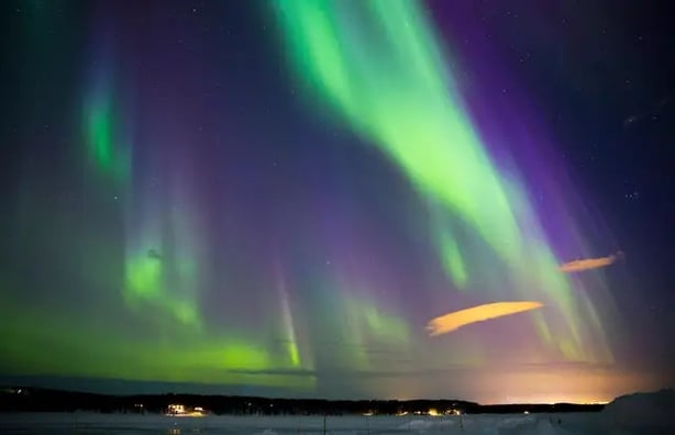 The Northern Lights over Northern Sweden (Alamy/PA)