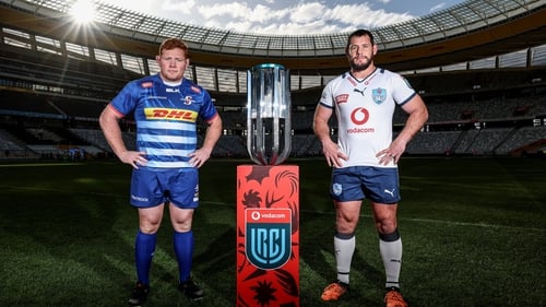 Stormers captain Steven Kitshoff and Bulls skipper Marcell Coetzee stand alongside the URC trophy