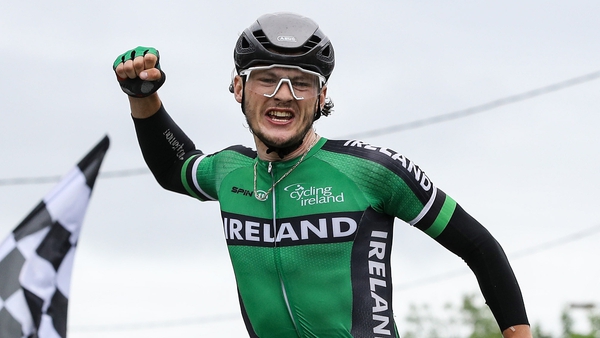 Adam Ward of the Irish Team celebrates as he crosses the line to win