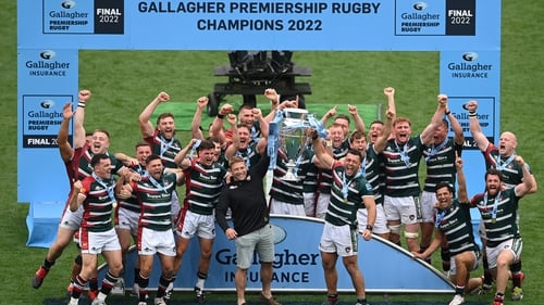 Tom Youngs and Ellis Genge lift the Premiership trophy surrounded by their Leicester Tigers teammates